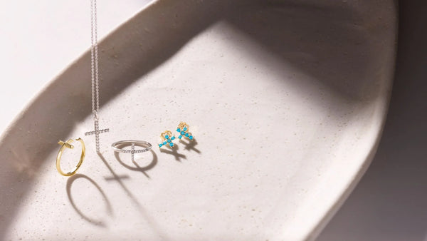 Religious Jewelry Pieces on a Background Stone Container | Glor-e