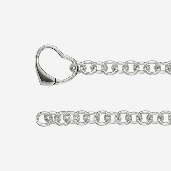 Side view of sterling silver Christian bracelet with heart clasp