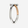Side view of white and rose gold diamond cross rope Christian ring for women