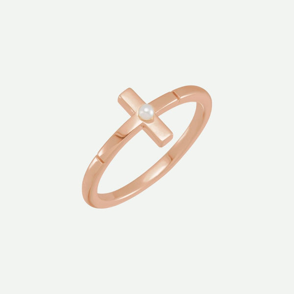 Front view of the PRECIOUS rose gold cross ring adorned with a central pearl, uniting warmth, elegance, and devotion.