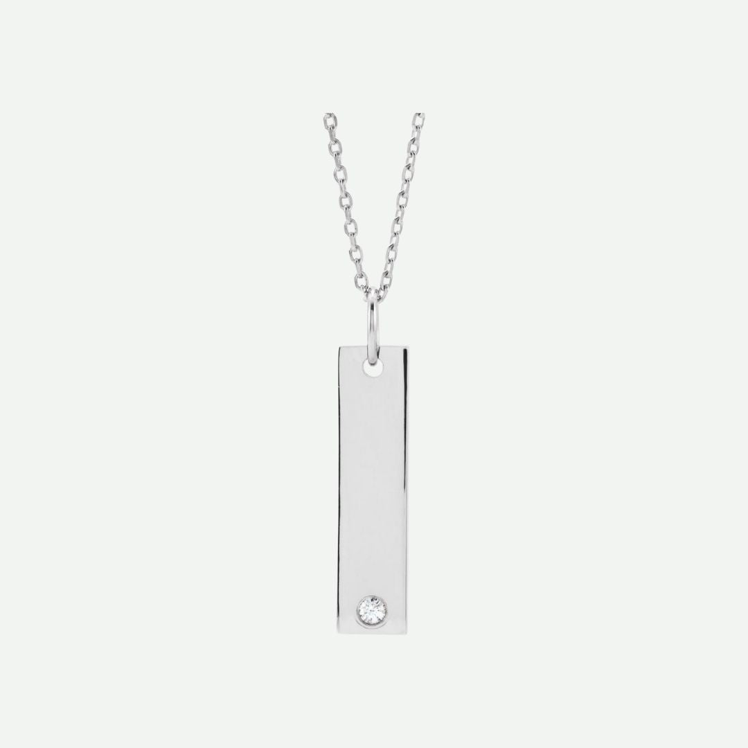 Front view of a 14k white gold engravable necklace with a rectangular pendant on a white background