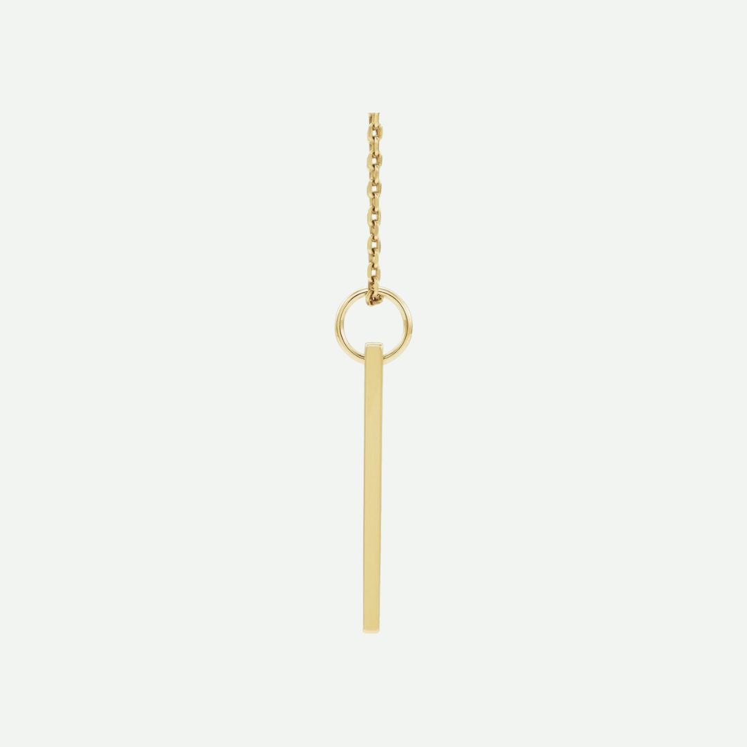 Side view of a 14K yellow gold engravable necklace with a simple pendant on a white background