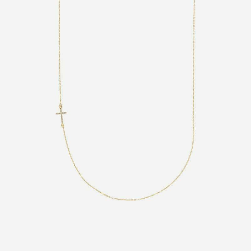 Half view of yellow gold Accented Sideways Cross Christian necklace for women