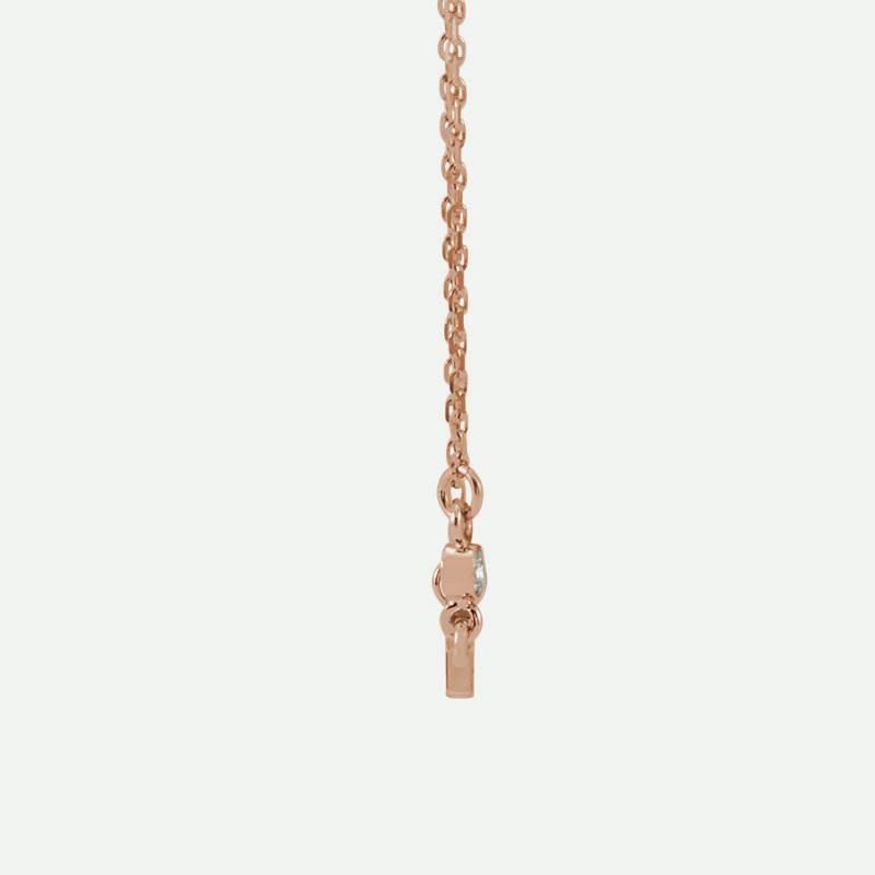 Side view of rose gold Sideways Cross Christian necklace for women